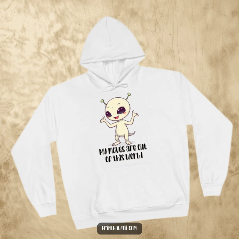 Funny alien character performing a hilarious dance on a cozy hoodie, designed for comfort and showcasing extraterrestrial silliness.